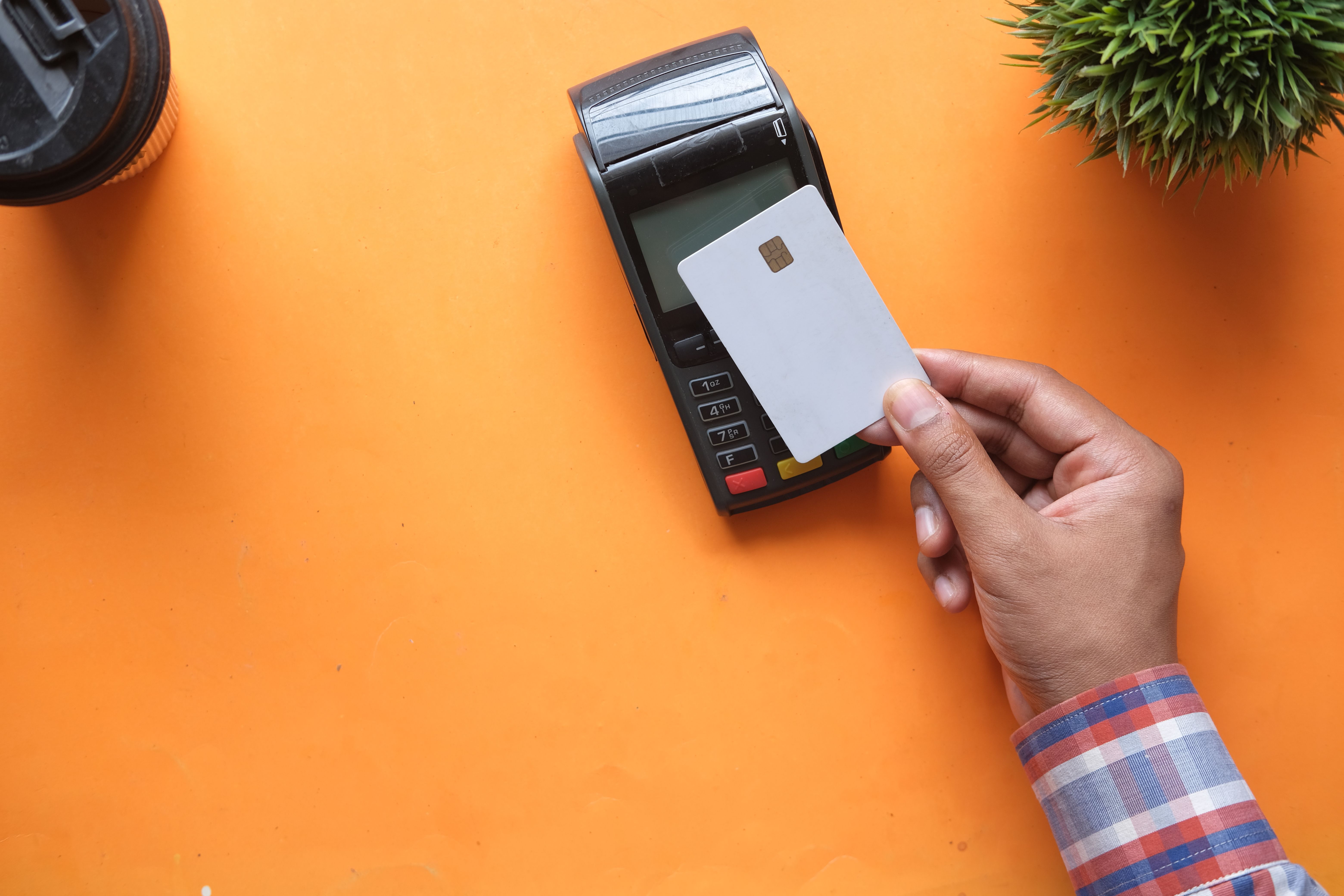 Contactless payment card being tapped, representing UK online casino deposit methods